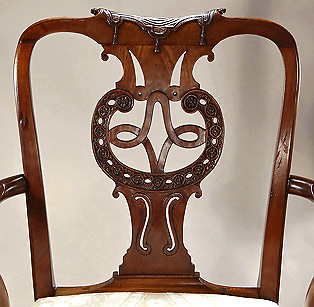 An Early George III Scottish Carved Mahogany Open Armchair, bacl with Celtic knots and tassels